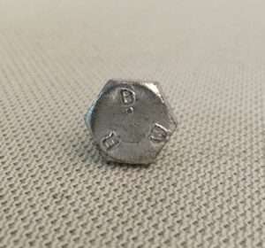 Close-up of a metal bolt on fabric.