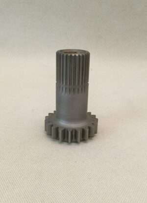 Metal gear and shaft on white background.