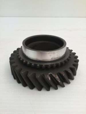 Metal gear with internal bearing on white background.