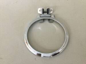 Metal clamp on textured surface.