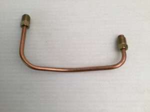 Copper pipe with brass fittings on white background