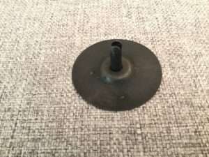 Rubber suction cup on textured fabric.
