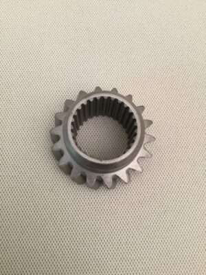 Metal gear on textured background