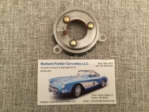 Car part and business card for Corvette specialist.