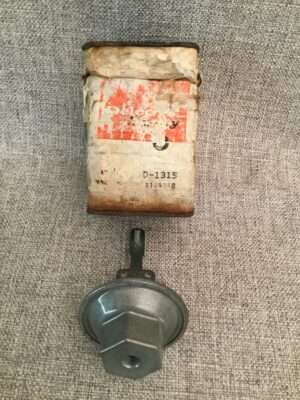 Old industrial sensor with a damaged label.