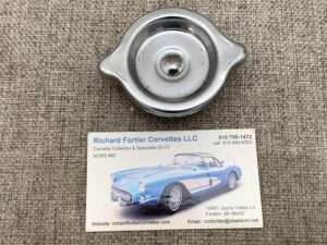 Vintage Corvette specialist business card and car part.
