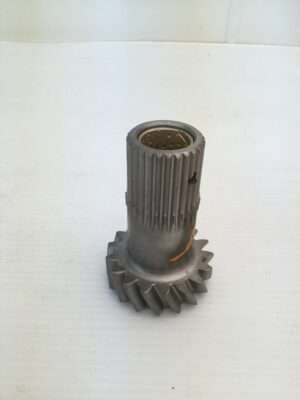 Metal gear on white surface.