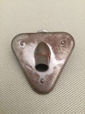 Triangular metal wall hook on textured surface.