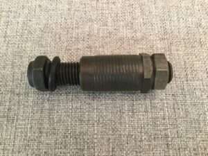 Black industrial bolt with washer and nut.