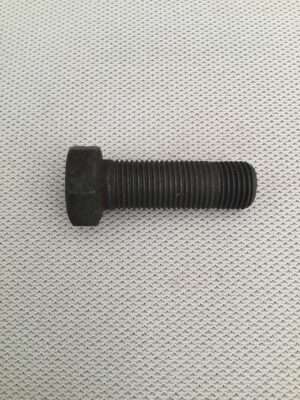 Black hex bolt on textured background