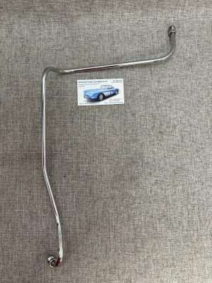 Chrome metal car part on fabric background.