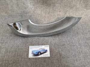 1958-62 Corvette L.H. Lower Front Crescent Molding, NOS (Lightly Damaged) SKU# 70