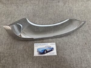 1958-62 Corvette L.H. Lower Crescent Molding w/ Studs, NOS, Original Box SKU# 79